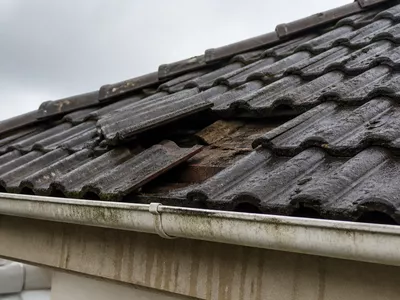 North East Roofing inspecting a roof for storm damage