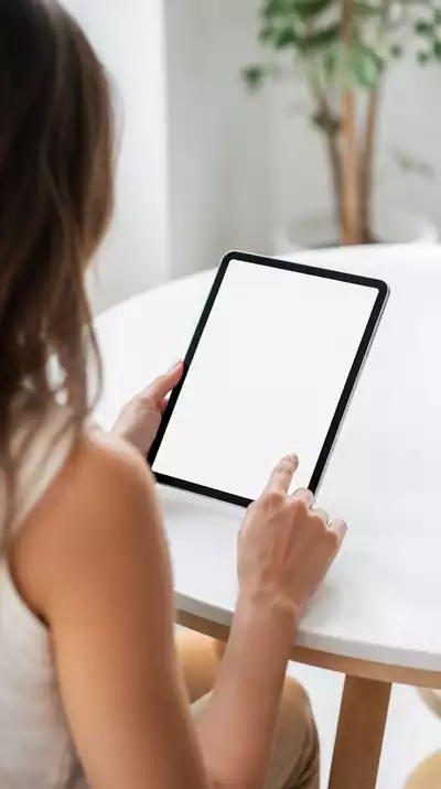 User submitting online form on tablet